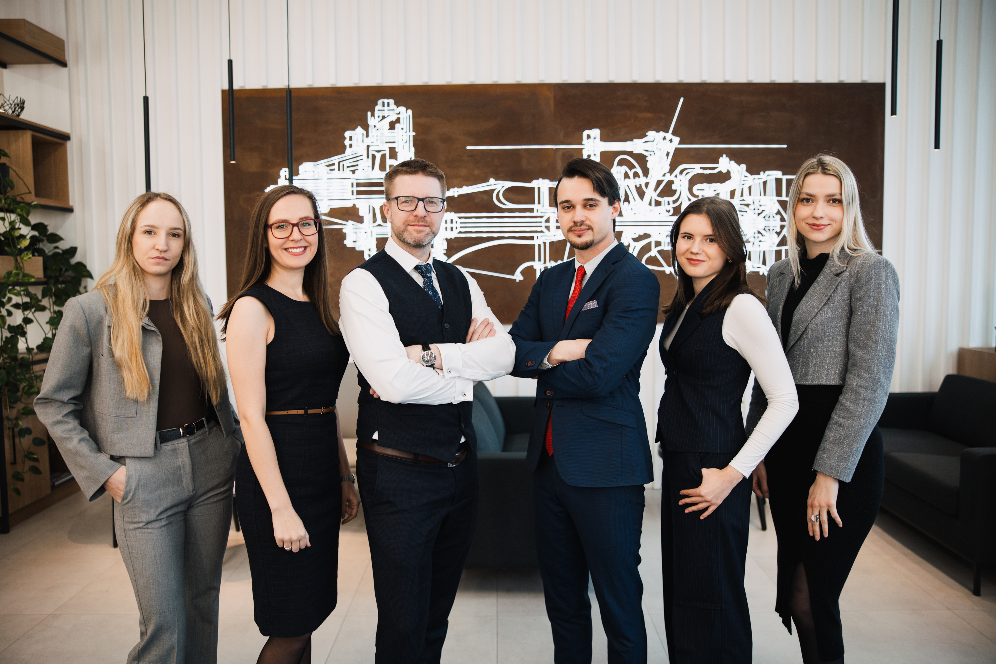 Legal team discussing strategic M&A and asset buyout differences for CFOs in the Czech Republic.