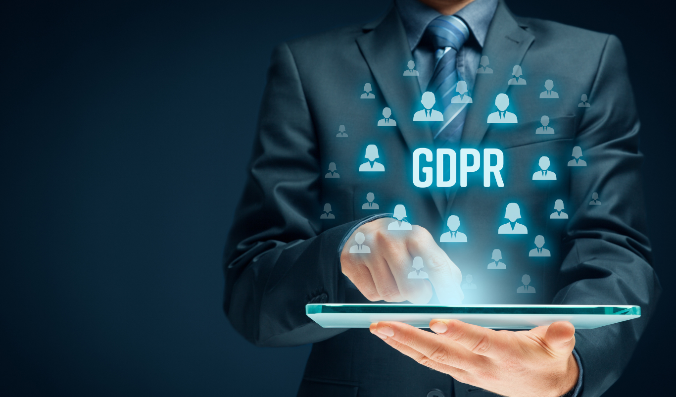 Businessman interacting with a digital interface highlighting GDPR, symbolizing AI and data protection.
